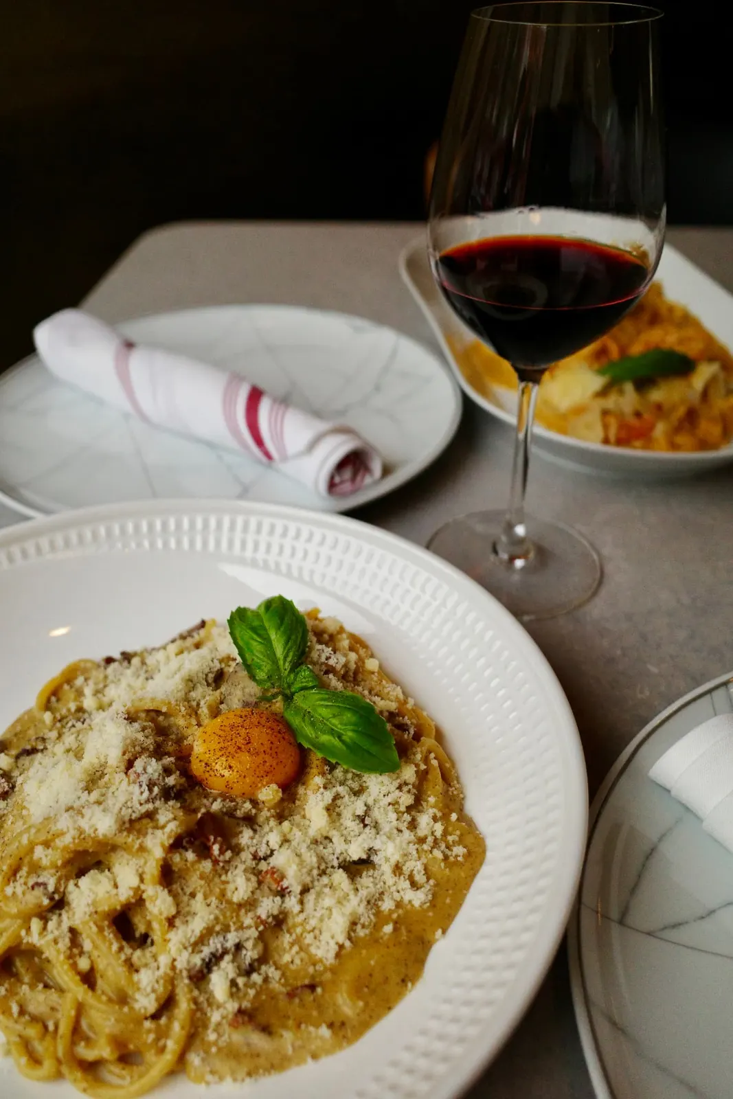 Carbonara and a glass of red wine at Five Corners Ristorante
