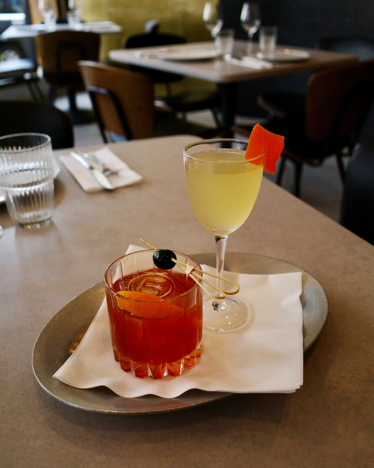 Two signature cocktails served on a tray at Five Corners Ristorante