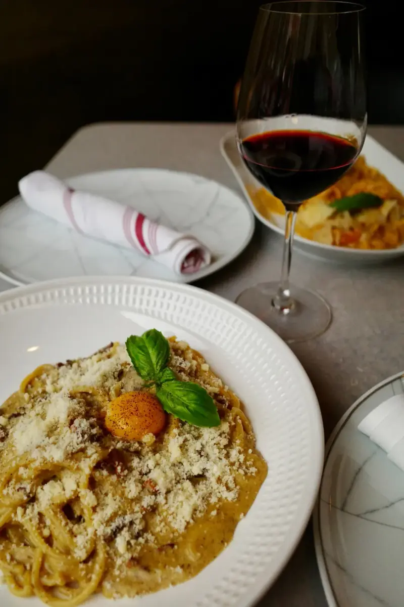 Carbonara and a glass of red wine at Five Corners Ristorante